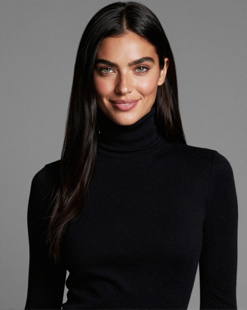 Woman in black turtleneck smiling